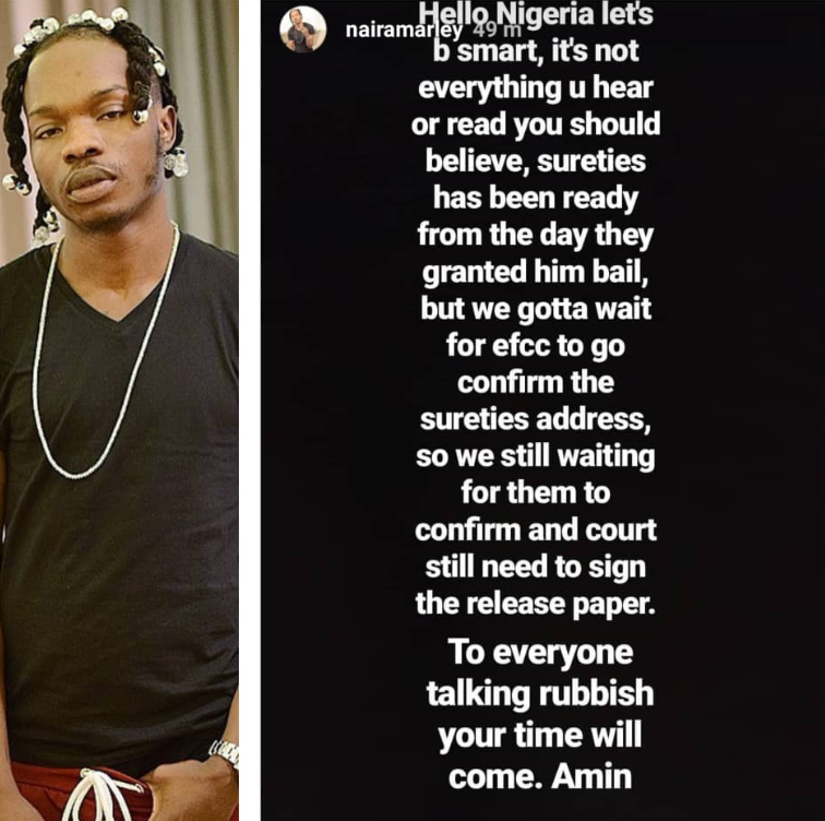 The management of embattled singer, Afeez Fashola aka Naira Marley, has reacted to allegations that the singer who was granted bail by a Lagos court on May 30th, is yet to be released from prison because no one wants to stand as surety for him. Reacting to the allegation, his management in a post shared on his Instastories this morning, said there are sureties already on ground to sign his bail but the delay in releasing the singer is because the antigraft agency, EFCC, needs to verify the information provided by the sureties and this takes time. Naira Marley was arrested on May 10th, his birthday. He was charged to court on 11-counts of fraud and internet scam. After spending 20 days in EFCC custody, he was granted bail in the sum of 2 Million Naira with sureties with landed property in Lagos.