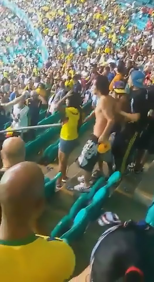 This is the shocking moment two female fans got into a fight after Argentine’s Copa America Match, MySportDab reports. Chaos erupted inside of the Itaipava Arena Fonte Nova stadium in Brazil before the violence continued on the streets after the final whistle. A number of fans – some wearing Colombia shirts – were filmed fightingon the steps inside of the ground. Punches were thrown and one shirtless supporter is continuously punched after being knocked to the floor. One female fan then raced down the steps and attempted to kick one of the rival supporters in the face. A number of supporters got involved in an attempt to stop the fight, but it ended up as a mass brawl.