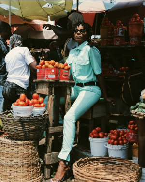 Popular singer Seyi Shay look Stuning and radiant as she becomes a pepper seller in a new photoshoot at a market for an upcoming video shoot.