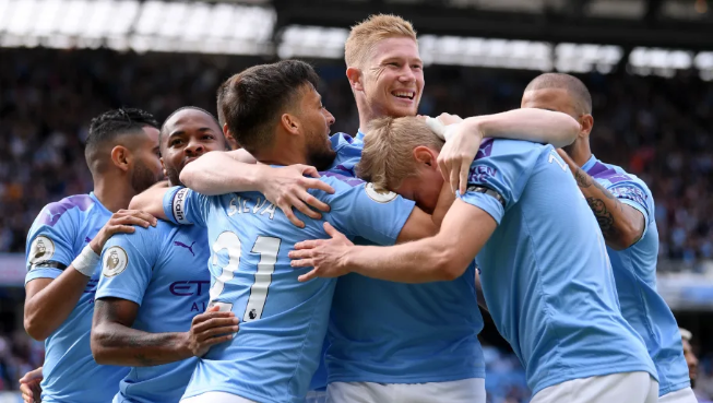 Sergio Aguero scores brace as ​Manchester City cruise 4-0 past Brighton on Saturday afternoon Premier League game at the Eithad Stadium.Belgium midfielder Kevin de Bruyne put Pep Guardiola’s men ahead inside the opening two minutes, latching on to a lovely ball from captain David Silva before Cityzen lost French defender Aymeric Laporte to injury as the former Athletic Bilbao player was carried off on a stretcher after a collision with Adam Webster before being taken to hospital. Aguero doubled the lead just before half-time with a composed finish and he claimed his second of the match with a stunning curling effort before the hour mark before Argentina international scored again ten minutes after the restart of the second part of the game to continue his record of scoring in all four of his team’s Premier League games this season.Substitute Bernardo Silva completed the scoring with his second touch after replacing David Silva as the Citizens ran out comfortable winners against a dogged Brighton side.