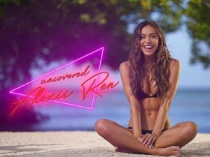 Alexis Ren earned her celebrity status by posing in front of cameras in bathing suits and completely nude. This time she is doing what she does best and posing for the latest issue of Sports Illustrated. She laid on a beach in Aruba in a miniature gold thong for this shoot, while other photos show off her perky tits and playful smile. Alexis looks like a real mermaid in these photos.