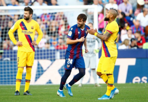 La Liga champions Barcelona fell to a shock 3-1 defeat away to Levante on Saturday, ending a seven-game winning streak in all competitions. The visitors were first to strike, but then conceded three times in the space of seven minutes in the second half.Barca had returned to the top of the table by thrashing Real Valladolid 5-1 earlier this week, and were in a comfortable position when Lionel Messi converted a penalty in the 38th minute.But their problems began when Luis Suarez was taken off injured a few moments later and a second-half collapse ensued, with Levante scoring with their first three shots on target. Jose Campana leveled in the 61st minute following a quickfire counter-attack after winning the ball in Barca’s half, then former Real Madrid striker Borja Mayoral put them ahead in the 63rd with a superb curling strike from outside the area.Nemanja Radoja gave the home side extra breathing space with a volleyed goal in the 67th following a free kick, while Messi found the net later to briefly give Barca hope before a VAR review saw the goal ruled out due to Antoine Griezmann being offside.It was Barca’s third defeat of the campaign and — though they still lead the standings on 22 points after 11 games — Atletico Madrid and Real Madrid can both climb above the Catalans if they win their matches later on Saturday.Levante, who have won three of their last four home fixtures against Ernesto Valverde’s side, moved up to eighth in the table on 17 points.
