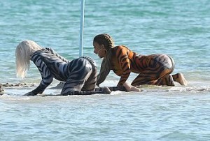 Did we see a pussy- cat? We thought we saw a pussy- cat! Oh, no it is Cardi B, with full body paint, dancing and twerking on the beach, showing that big, round ass and hot cameltoe to everyone and obviously having tons of fun with friends.