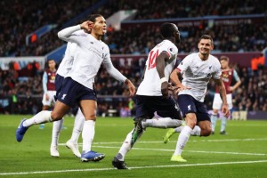 Sadio Mane heads in 94th minutes winner to complete a remarkable turnaround for Liverpool after Andy Robertson canceled out Trezeguet’s opener for the hosts in the 2-1 over Aston Villa encounter in the Premier League. Trezeguet had given the home side the lead after 22 minutes to score the first goal for the club with a volleyed finish from John McGinn’s free-kick.Virgil van Dijk then showed how his abilities go beyond just defending, lumping a pinpoint 50-yard ball to Mohamed Salah and the Egyptian was denied by Tom Heaton from a tight angle. The flag was raised for offside and on the replay, it appeared that Firmino was in line with Mings. But after the VAR calculations, the 28-year-old was, incredibly, found to have been offside by his armpit.Liverpool scored two late goals first from Andy Robertson when he arrived at the back post to head them level before Mane find the winner in the injury time after he run to head Alexander-Arnold’s corner to win it as Jurgen Klopp preserve their six-point lead at the top of the Premier League.