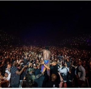 Excited Nigerian Afrobeats artiste, Burna Boy goes shirtless as he poses with his mum at his concert, ‘The Africans Giant Return Tour’ in London. Gistmore reports  Burna Boy becomes the first Afrobeats artiste to sell out SSE Arena Wembley in London.