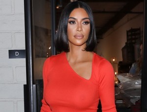 One of the brightest representatives of the Kardashian family, Kim Kardashian, fell into the lens of paparazzi when she walked along the street. This hot brunette was wearing a bright red blouse and pink trouse