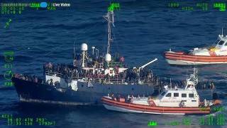 Italian Coast Guard escorting 1,200 migrants on boats in Mediterranean Sea