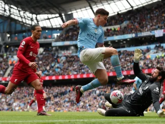 Manchester City thrashes Liverpool to keep in touch with Arsenal at top of English Premier League