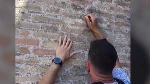 Colosseum: Man who carved names on ancient Rome amphitheatre is UK tourist, Italian police say