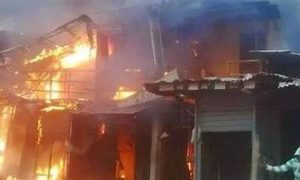 Woman burns as fire destroys a building in Lagos