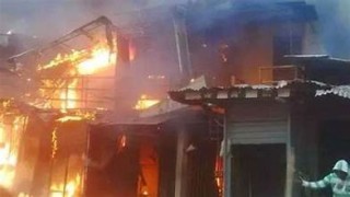 Woman burns as fire destroys a building in Lagos