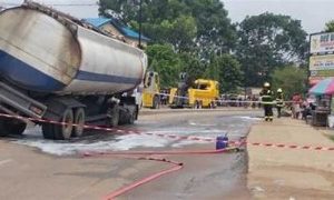 In Lagos, a fuel tanker overturns and spills its cargo