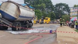 In Lagos, a fuel tanker overturns and spills its cargo