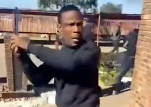 Knife and gun-wielding men drag out kids from South African school (video)