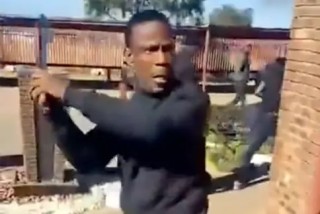 Knife and gun-wielding men drag out kids from South African school (video)