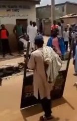 Man Captured Looting Police Signpost In Northern Nigeria (Photos)