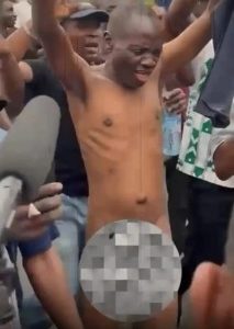 Man strips completely naked at protest ground (photos/video)