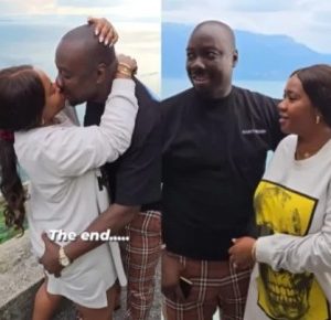 Obi Cubana and his wife pack on the PDA as they holiday abroad (video)