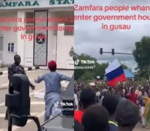 Viral video of Youths brandishing Russian flags matching towards Zamfara state government house