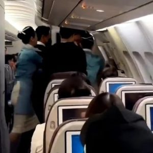 Moment Passenger Tries To Open Emergency Exit Door Sparking Panic On Flight To South Korea (video)