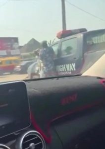 Lady Seen Beating A Police Officer In Roadside Fight (Video)