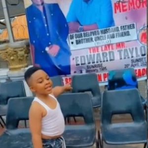 Moment boy confuses father’s obituary banner for birthday poster